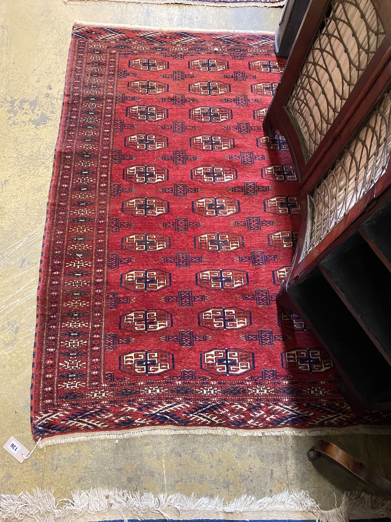 A Bokhara red ground rug, woven with rows of boteh, 160 x 120cm